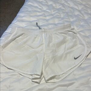 Nike Women's White Athletic Shorts with Gray Logo